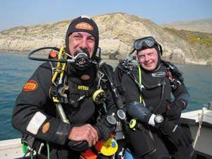 smiling divers on our club boat