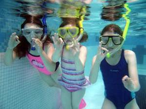 snorkelers in the pool